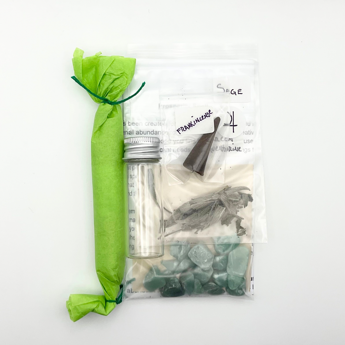 The Witch Joseph Prosperity Spell kit shown from the back of the packaging showing the contents against a white background.