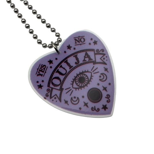Heart-shaped Ouija board planchette pendant in purple on a silver tone ball chain against a white background