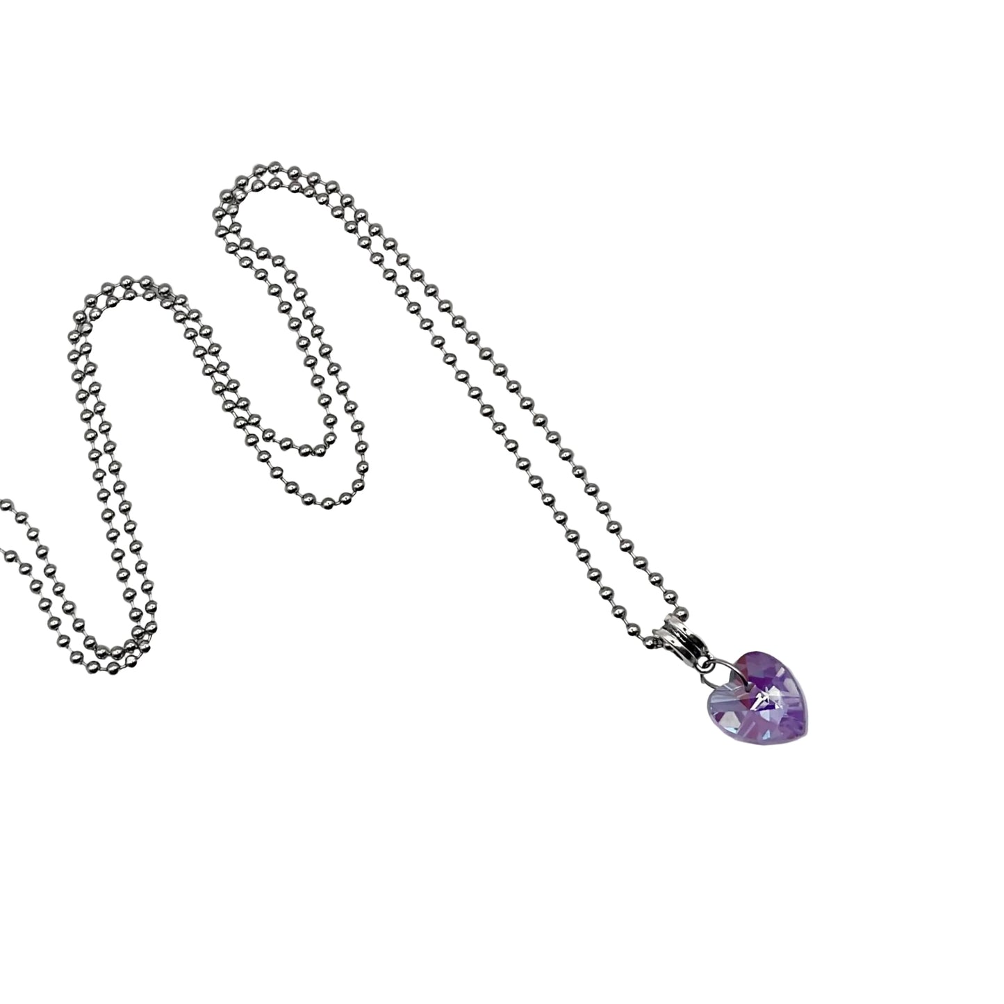 Necklace with a purple tinted heart-shaped crystal pendant on a white background
