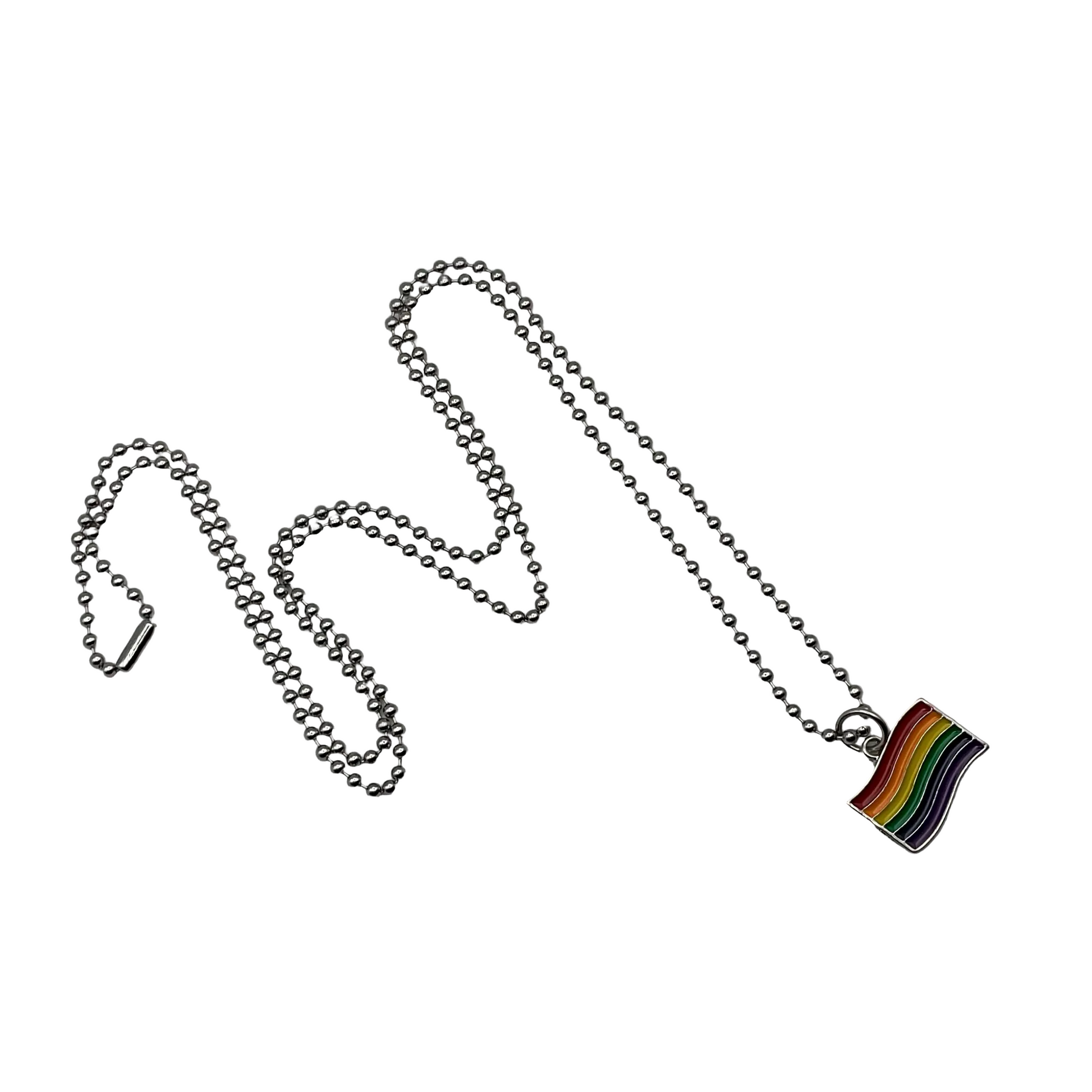 Metallic chain with a rainbow flag pride charm on a light gray background