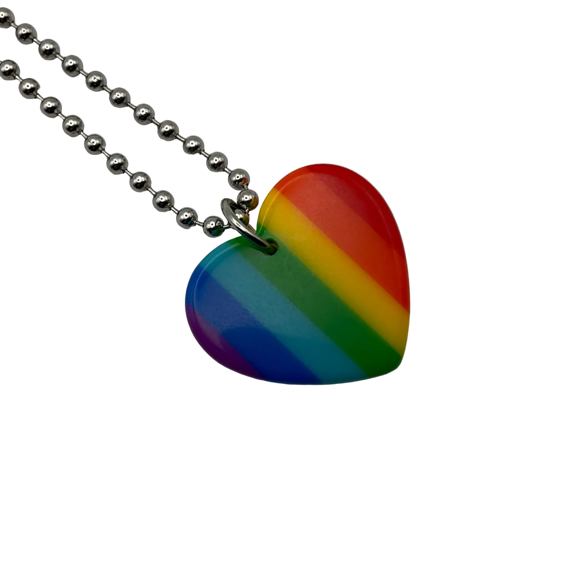 Rainbow heart-shaped acrylic pendant on a silver tone ball chain against a white background