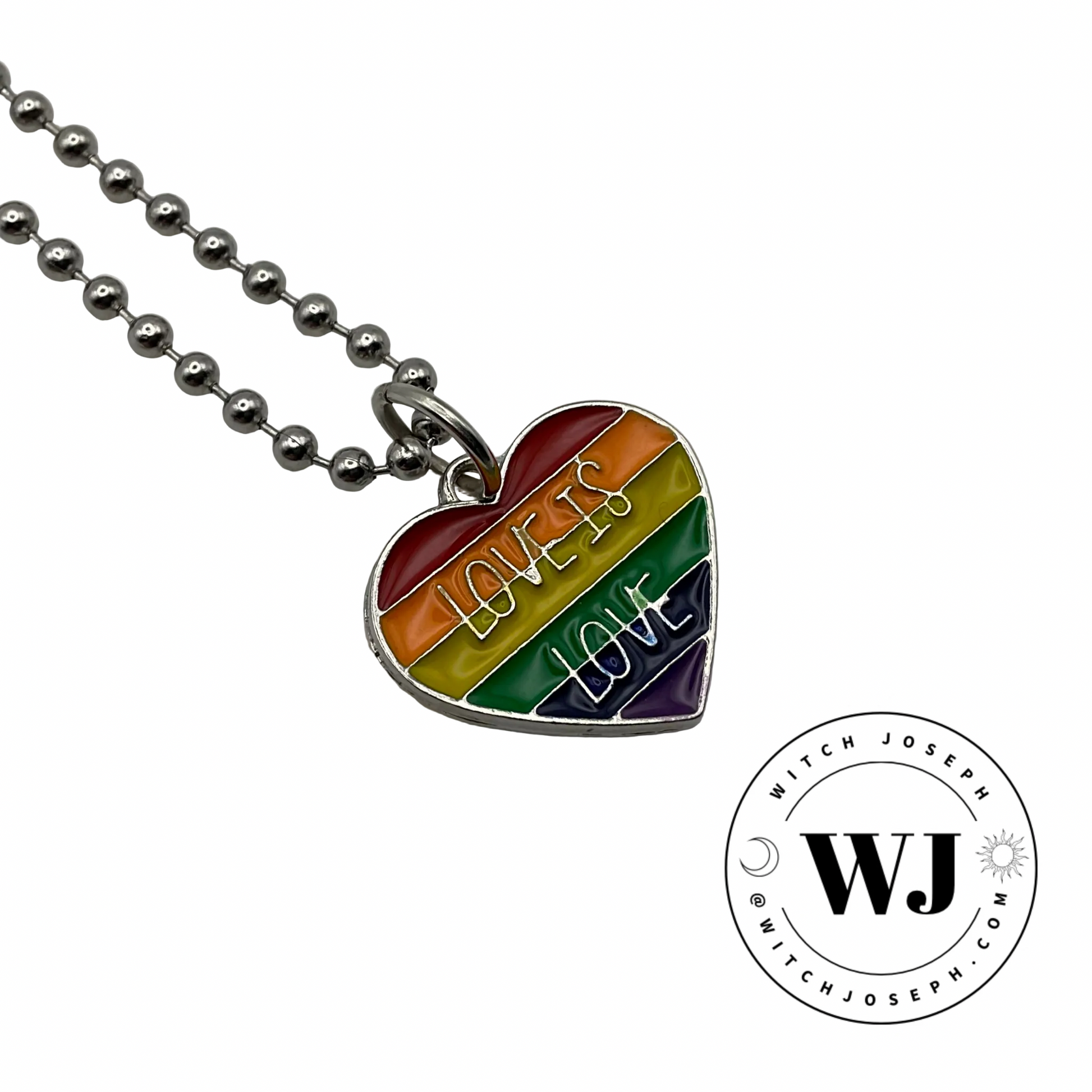 Heart-shaped rainbow pendant ball chain necklace with 'Love is Love' text displayed on a white background, featuring the Witch Joseph logo
