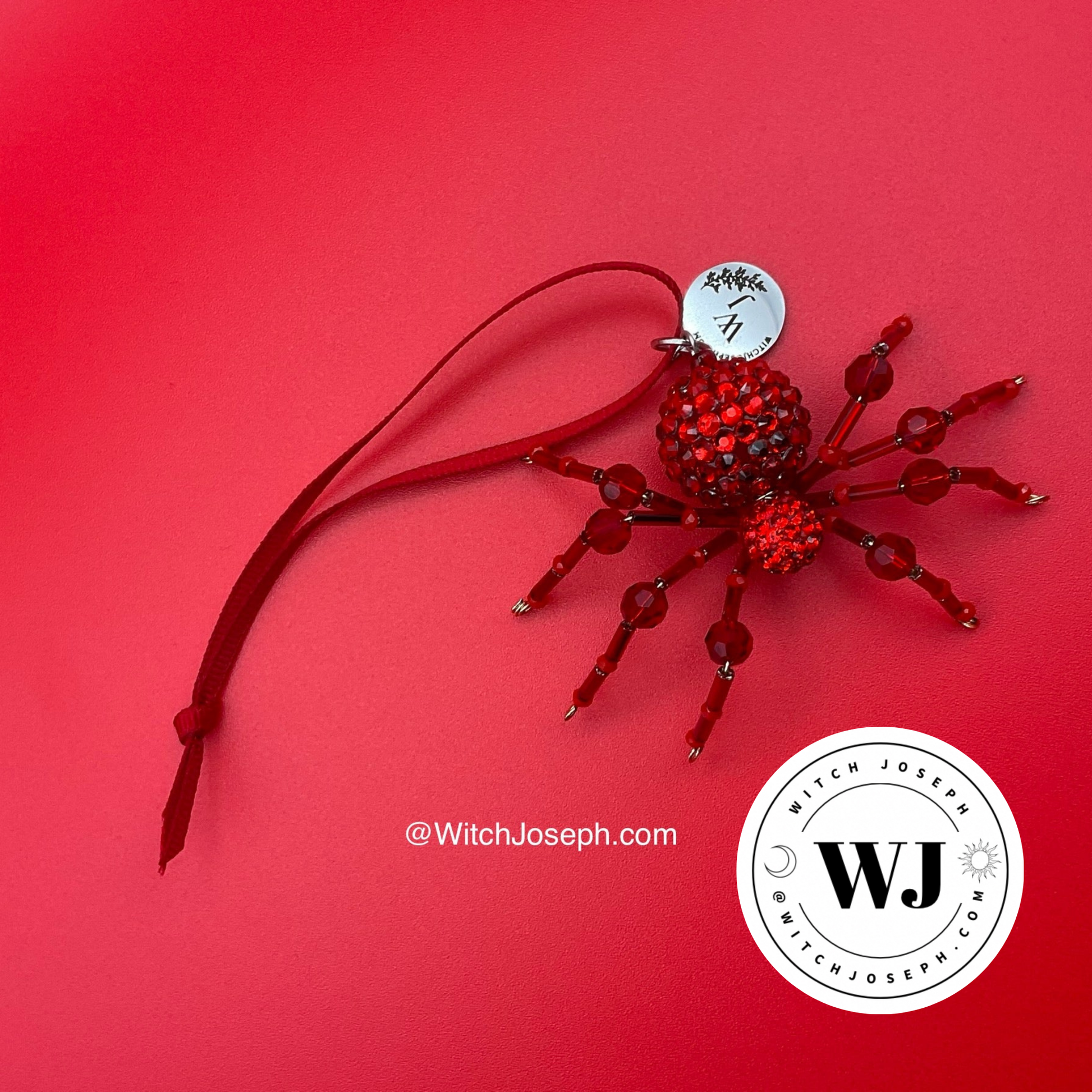 Red spider ornament on red background with the Witch Joseph logo