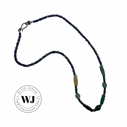 Roman Glass beads with Lapis Lazuli Necklace with blu, green and yellow beads displayed on a white background with the Witch Joseph logo