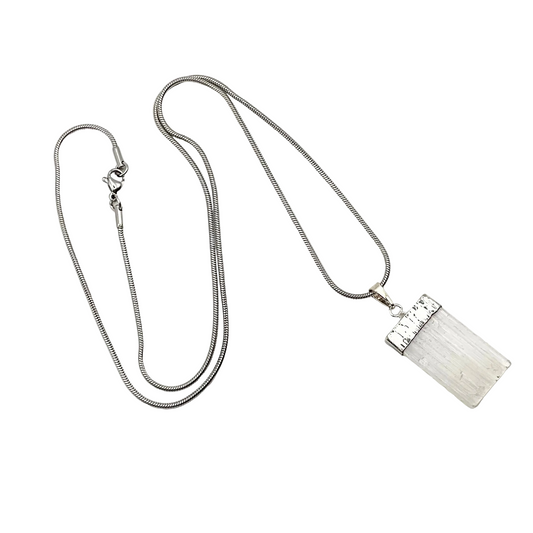 Silver necklace with a rectangular selenite pendant on a white background