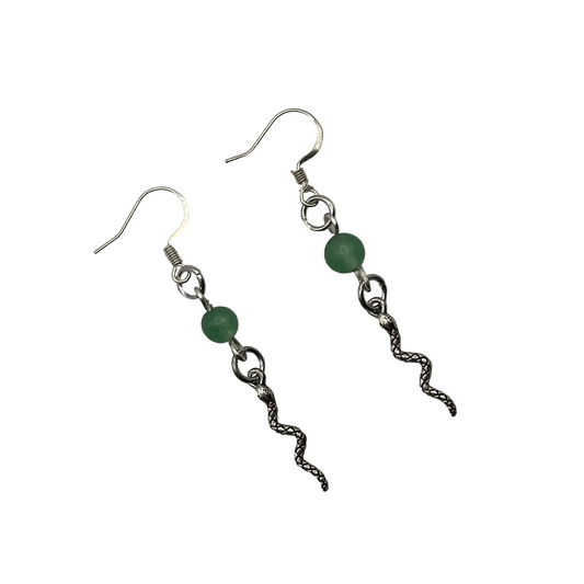Pair of silver tone earrings with an aventurine focal bead and a silver tone snake dangle displayed against a white background
