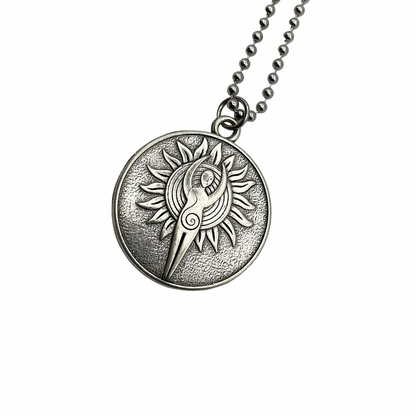 Silver tone necklace with a sun and Goddess pendant on a white background