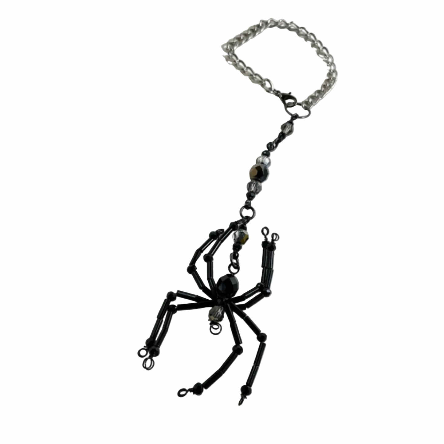 Black spider-shaped Sun Catcher with iridescent accent beads on a chain against a white background