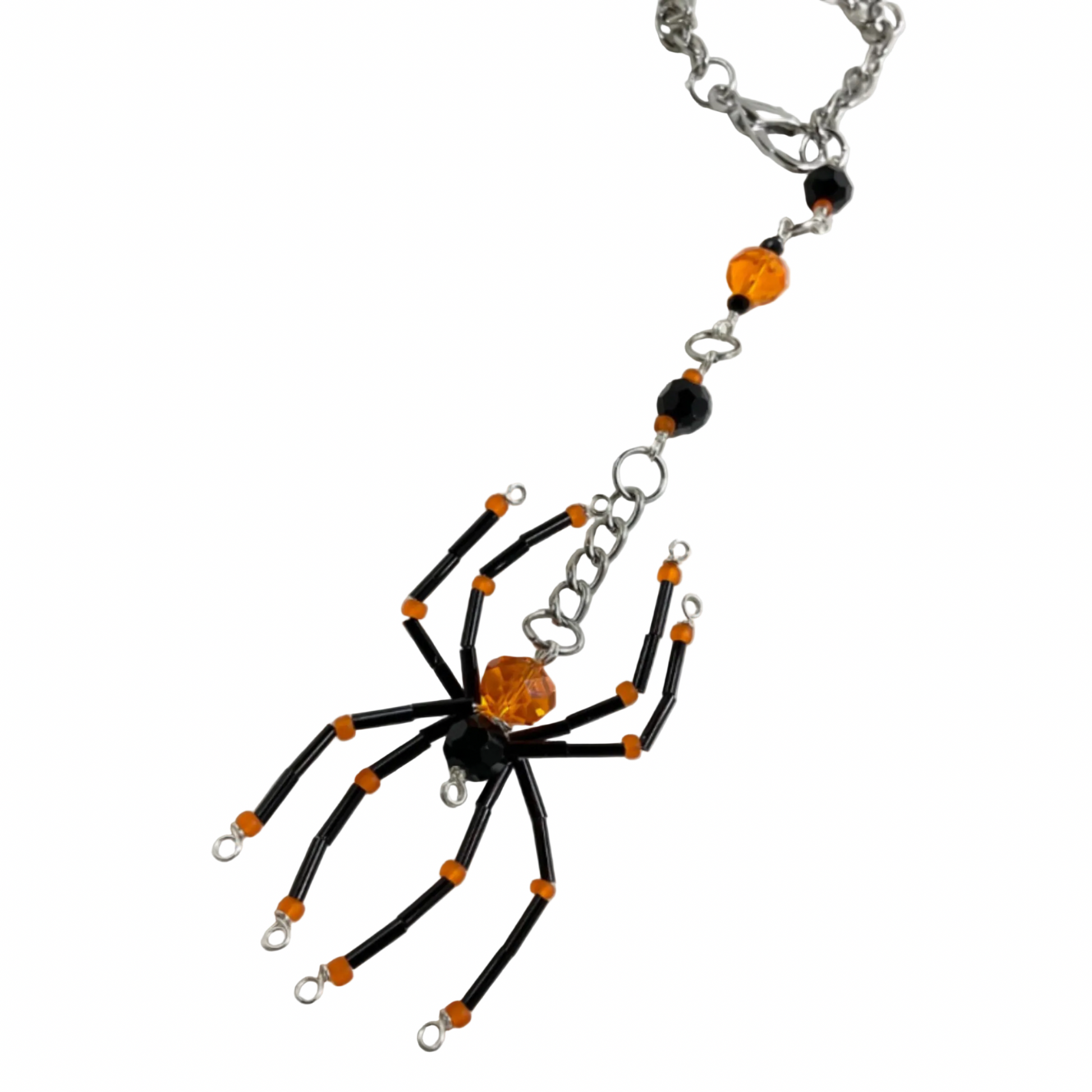 Spider-shaped Sun Catcher in orange and black on a white background