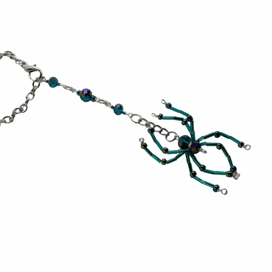 Beaded Sun Catcher car charm with a turquoise spider-shaped charm on a white background