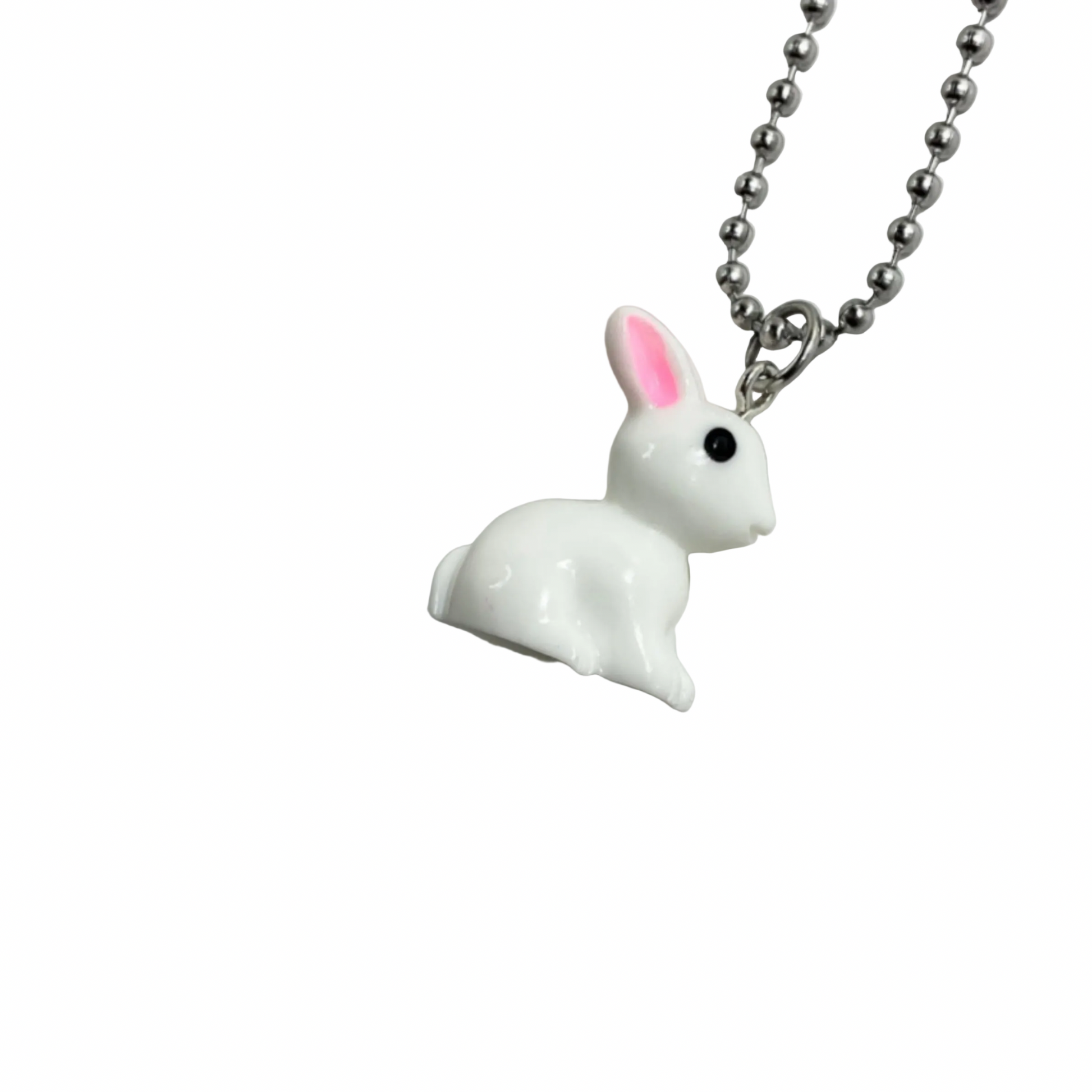 White rabbit-shaped pendant on a chain against a white background.