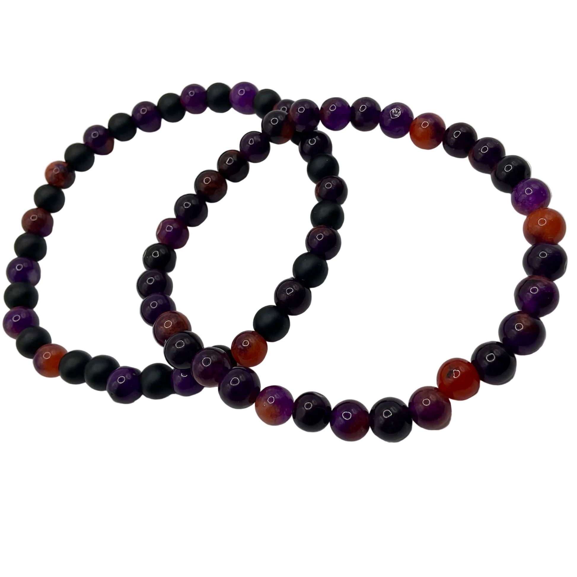 Two beaded bracelets with purple, black, and orange beads on a white background