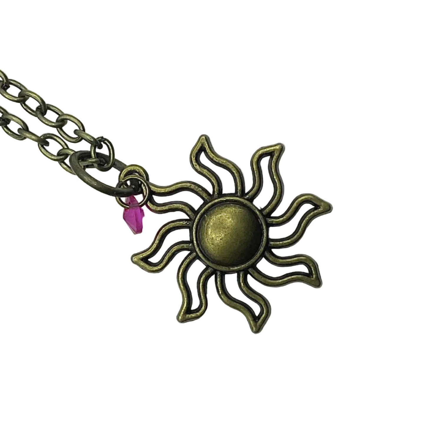 Sun-shaped pendant on a chain with a pink crystal against a white background