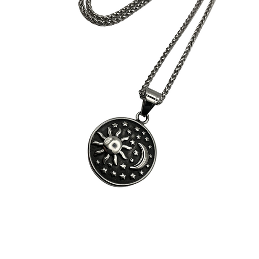 Stainless steel Talisman Necklace with a sun, moon, and star pendant on a white background