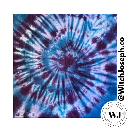 Tie-dye pattern with blue and purple swirls tarot cloth or altar cloth displayed on a white background, featuring the Witch Joseph brand.