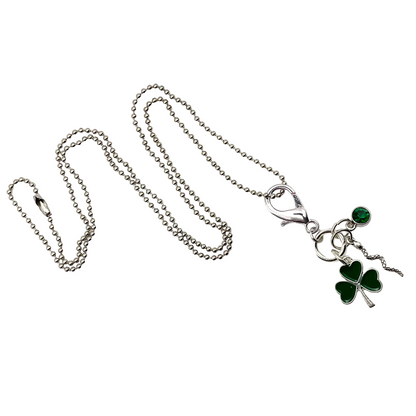 Silver tone All Snakes Day charm necklace with green shamrock, silver tone snake and a green crystal on a ball chain against a white background.
