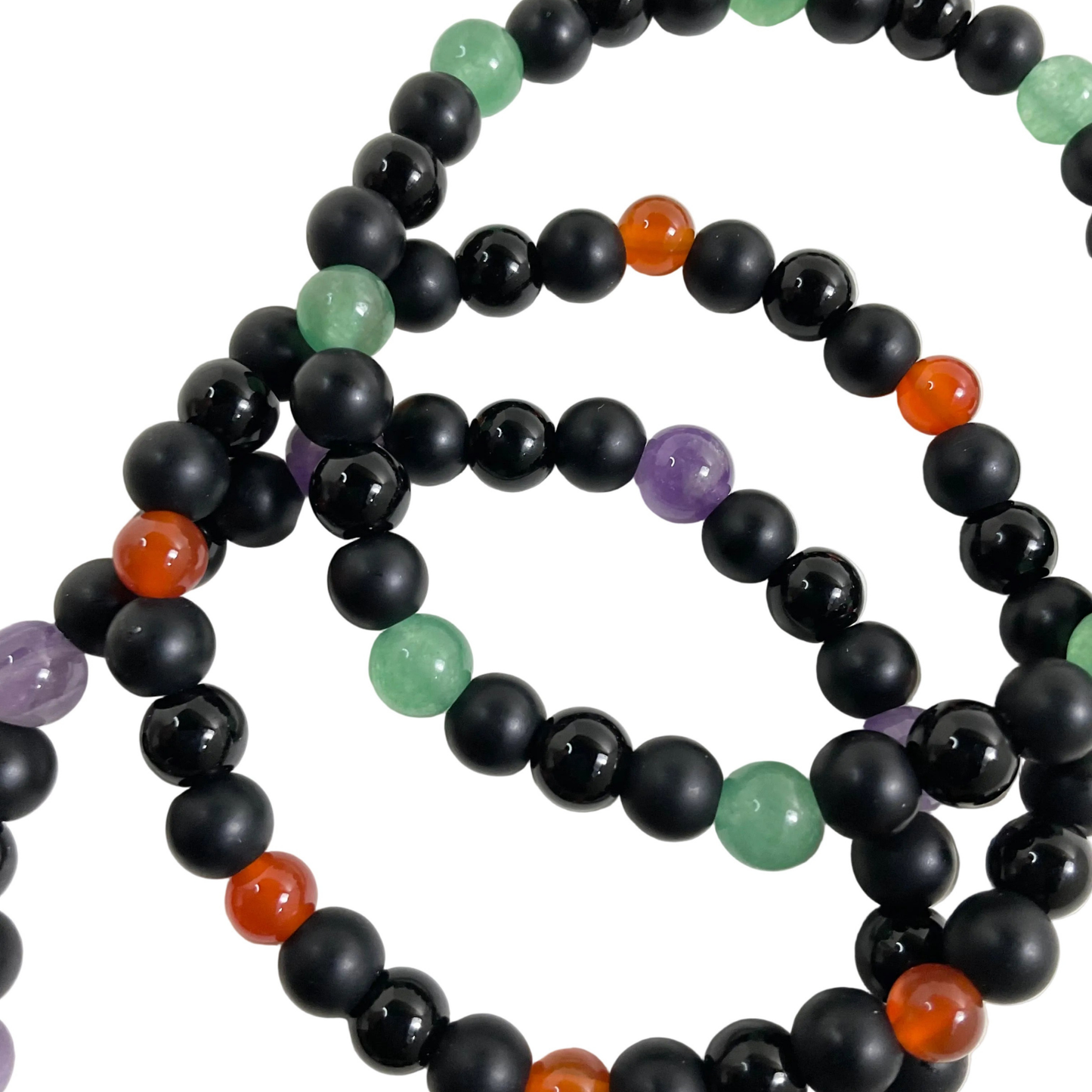 Black beaded bracelets with purple green and orange colored beads displayed on a white background