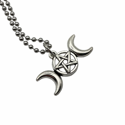 Silver tone Triple Goddess Lunar symbol charm with pentacle in the center on a silver tone ball chain displayed against a white background