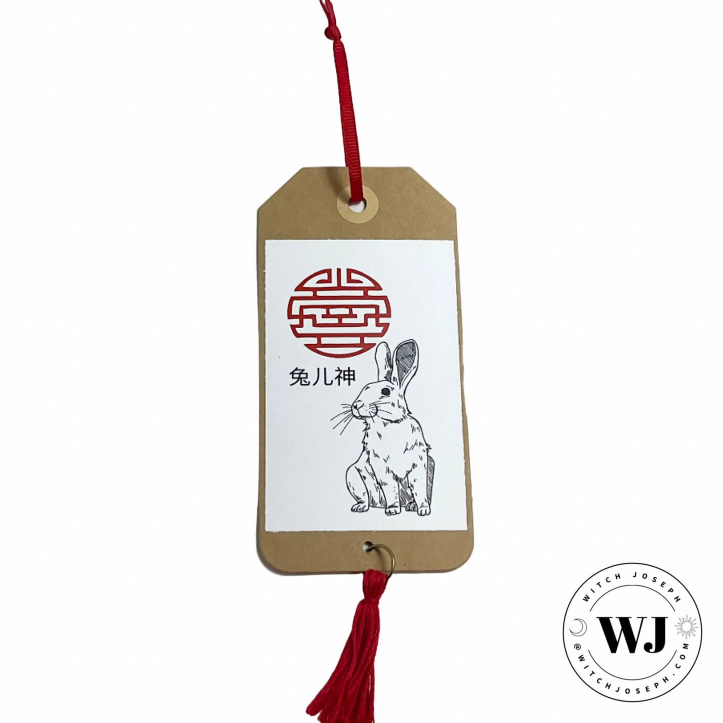 Tuer Shen Tag with rabbit illustration and red tassel on a white background