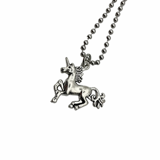 Silver tone unicorn pendant on a ball chain against a white background