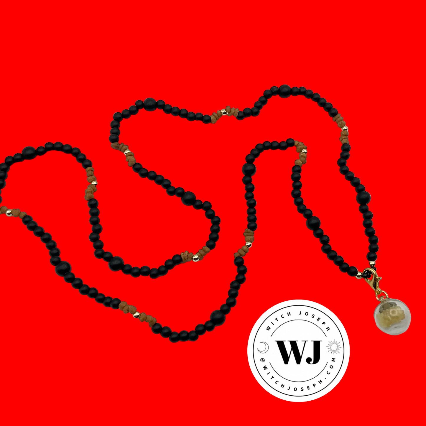 three kings necklace displayed on a red background with the Witch Joseph logo