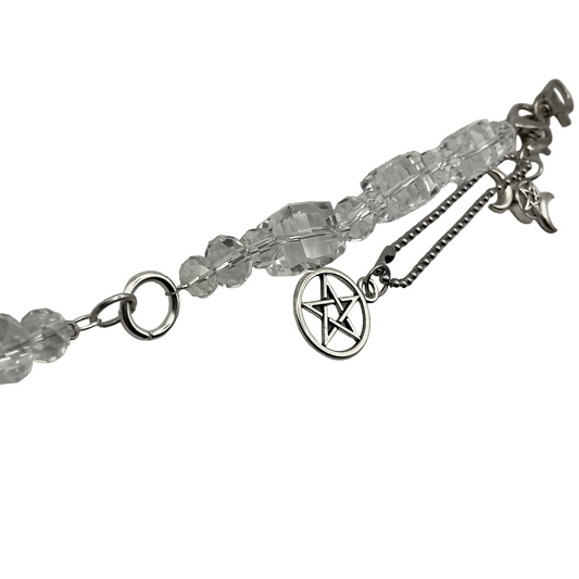 Bag charm with clear crystal beads and silver tone Pentacle and Triple Goddess charms on a light white background
