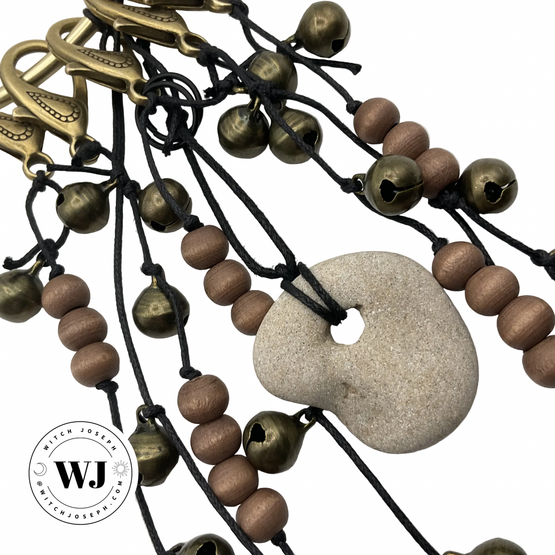 Door Charm with brown beads, pentacles, bells and a Holey stone…displayed  on a white background, featuring the Witch Joseph logo