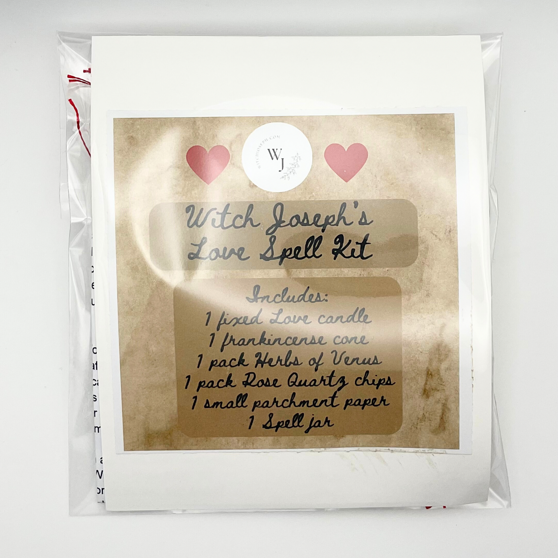 Witch Joseph's Love Spell Kit packaging with text and hearts on a white background