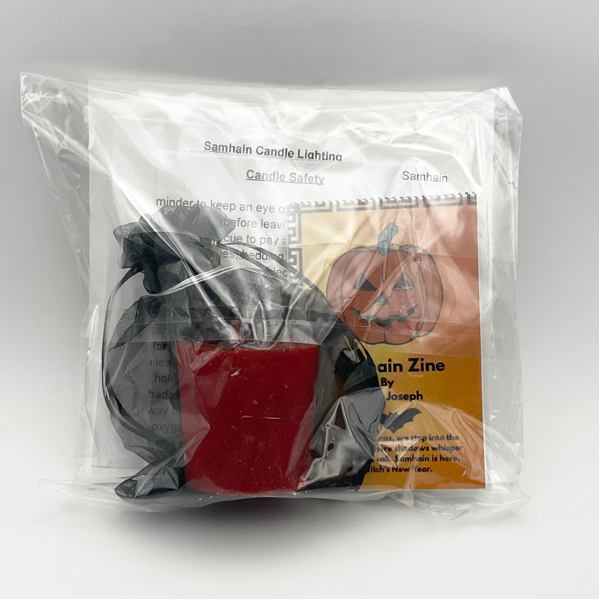 Halloween-themed product in clear packaging with text and images on a white background
