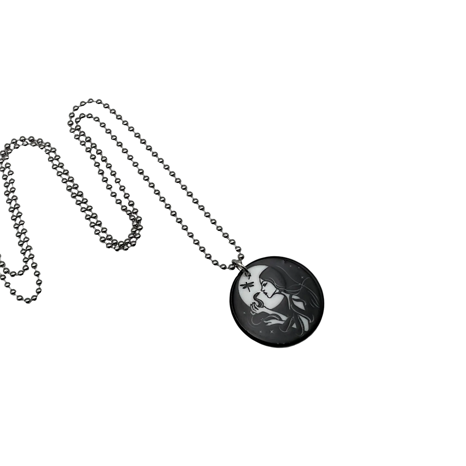 Necklace with a round pendant featuring an artistic design of a witch with her serpent familiar on a white background