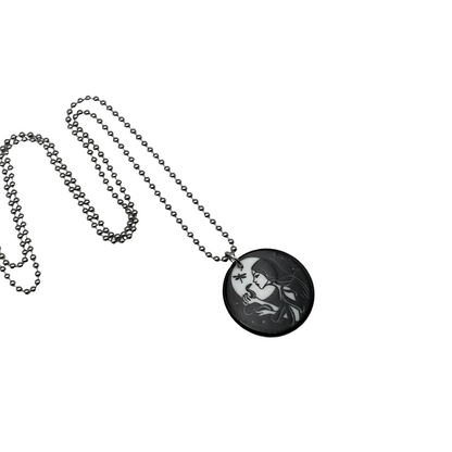 Necklace with a round pendant featuring an artistic design of a witch with her serpent familiar on a white background