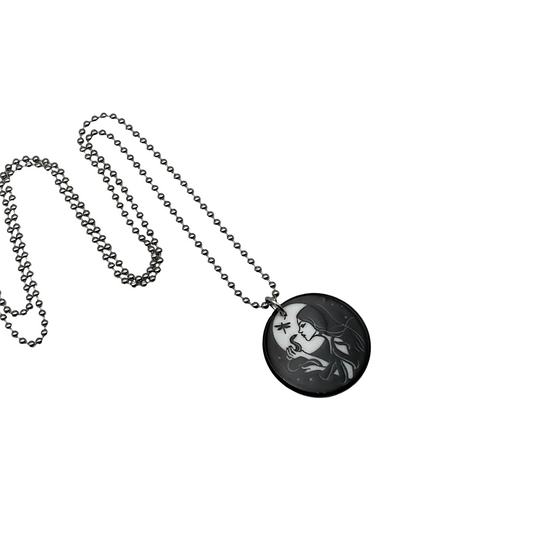 Necklace with a round pendant featuring an artistic design of a witch with her serpent familiar on a white background